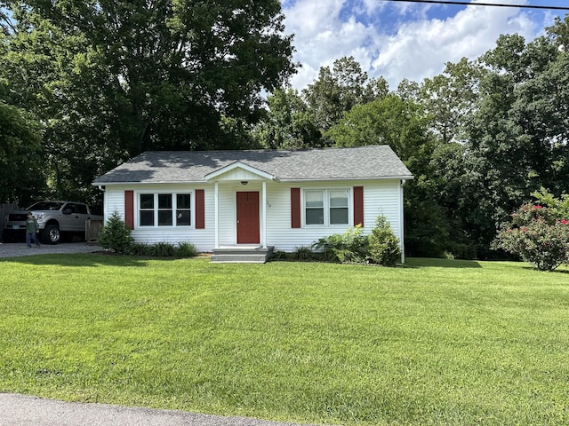 329 Castle Ln, Dover, TN 37058 - single story home featuring a front lawn and roof with shingles