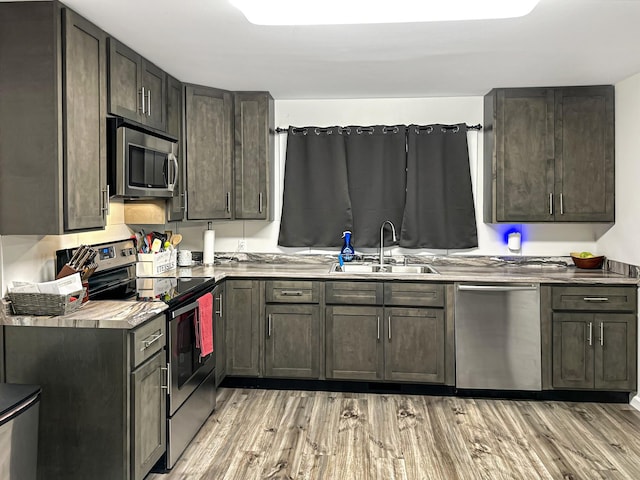 329 Castle Ln, Dover, TN 37058 - kitchen featuring appliances with stainless steel finishes, light wood finished floors, and light countertops