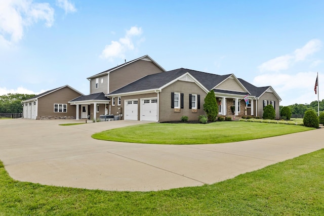 view of front of home with a garage and a front lawn