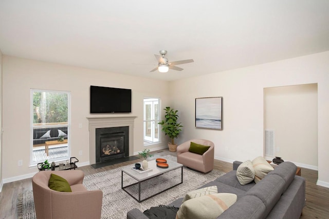 living room featuring hardwood / wood-style flooring and ceiling fan