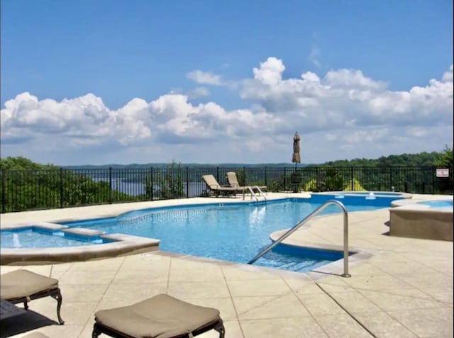 view of pool featuring a patio area and a community hot tub