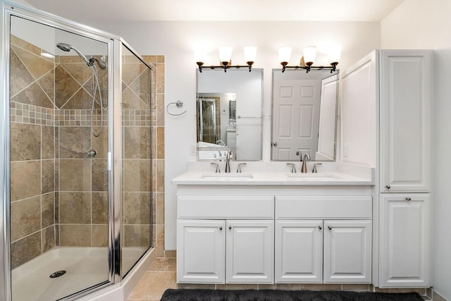 bathroom featuring an enclosed shower and vanity