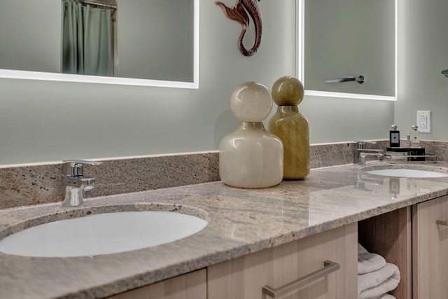 full bath with double vanity and a sink