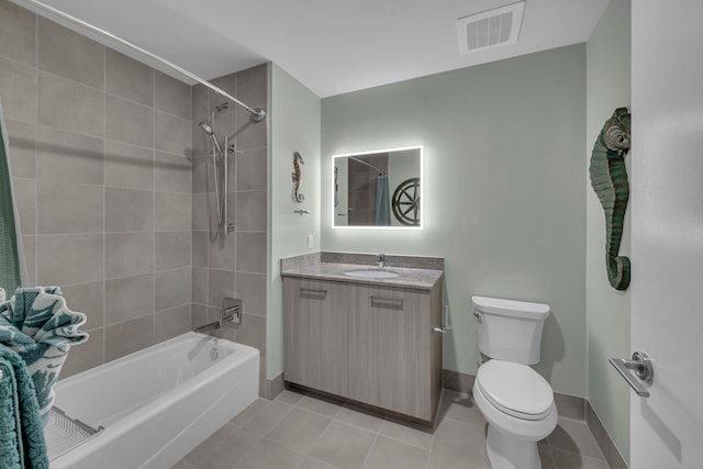 bathroom with visible vents, toilet, tile patterned flooring, bathtub / shower combination, and vanity