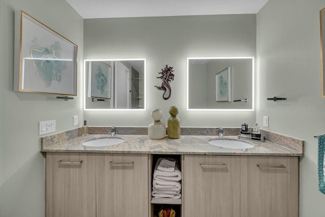 bathroom featuring double vanity and a sink