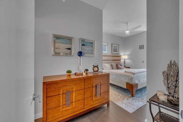 bedroom with visible vents, ceiling fan, and wood finished floors