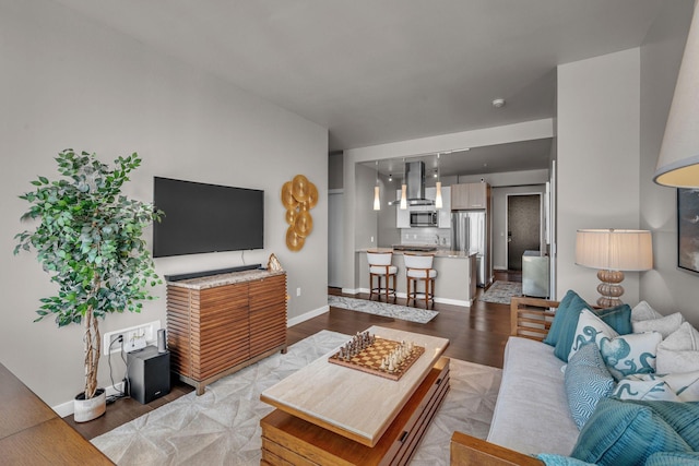 living room with light wood-type flooring and baseboards