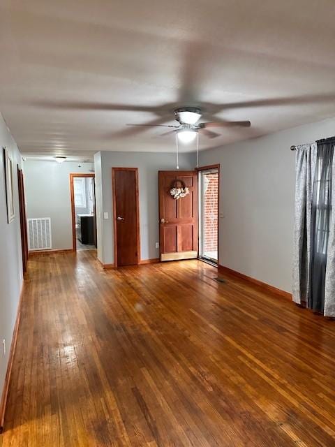 unfurnished room with hardwood / wood-style flooring and ceiling fan