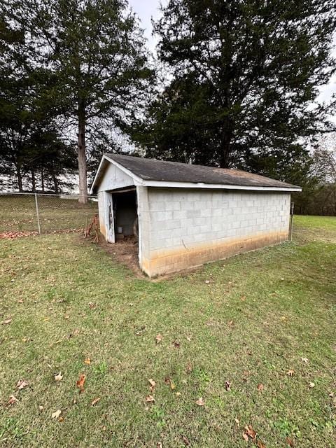 view of outdoor structure with a lawn