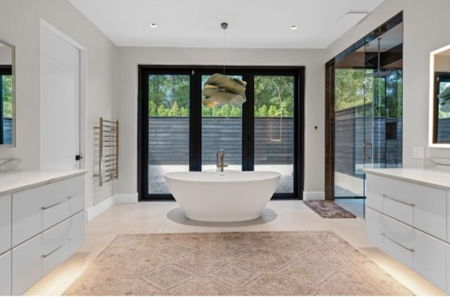 bathroom with vanity and plus walk in shower