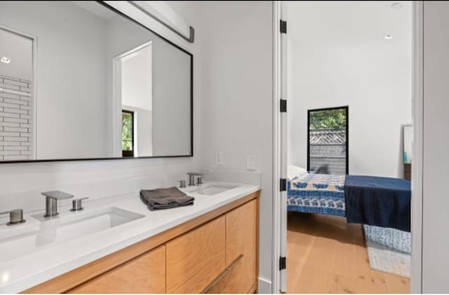 bathroom featuring vanity and wood-type flooring