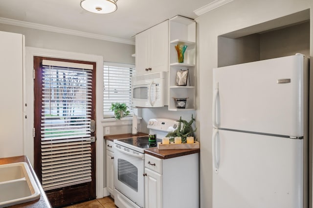 kitchen with light tile patterned flooring, sink, white cabinets, crown molding, and white appliances