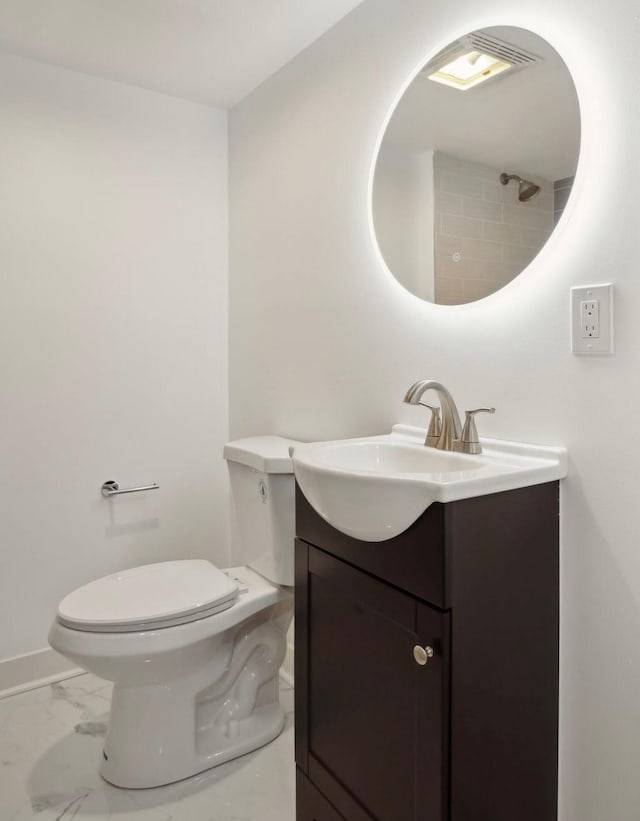 bathroom with visible vents, baseboards, toilet, marble finish floor, and vanity