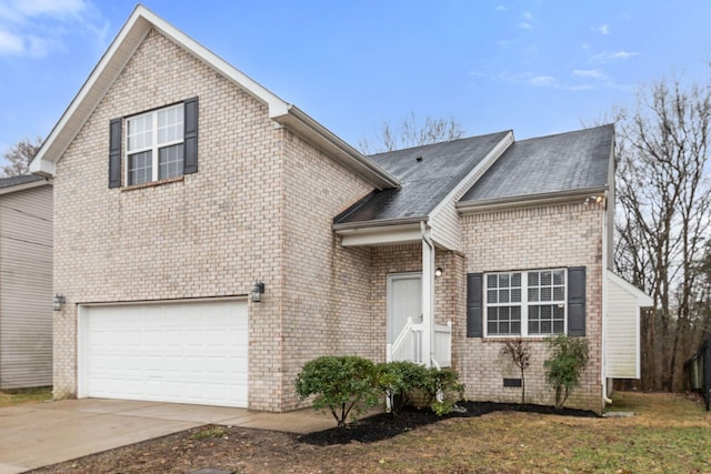 view of front of property with a garage