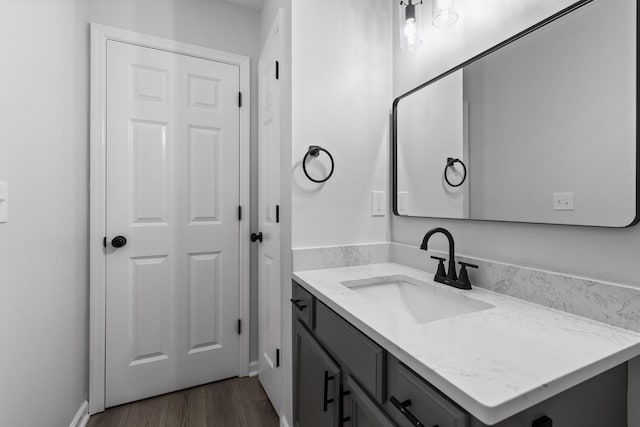 bathroom featuring vanity and hardwood / wood-style flooring