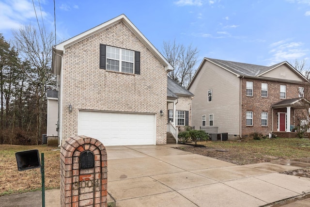 view of property featuring central AC unit and a garage