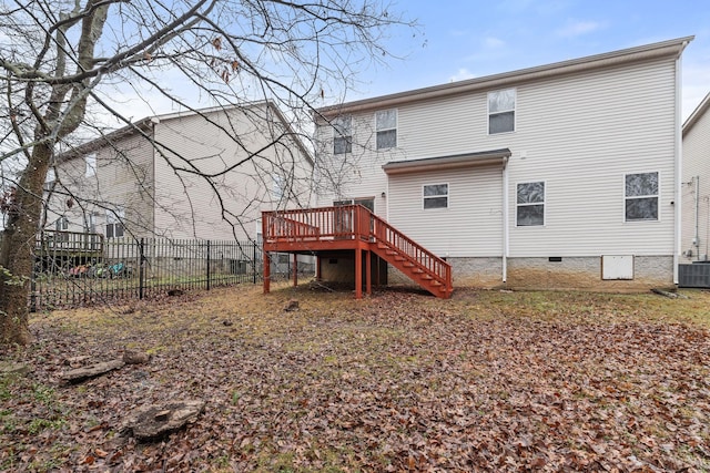 back of house featuring central AC and a deck