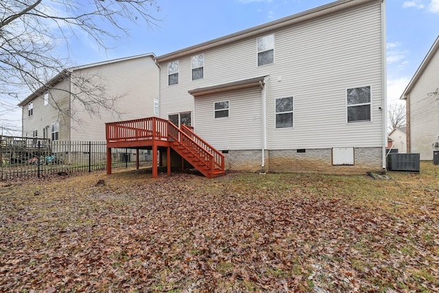 back of property featuring central AC and a deck