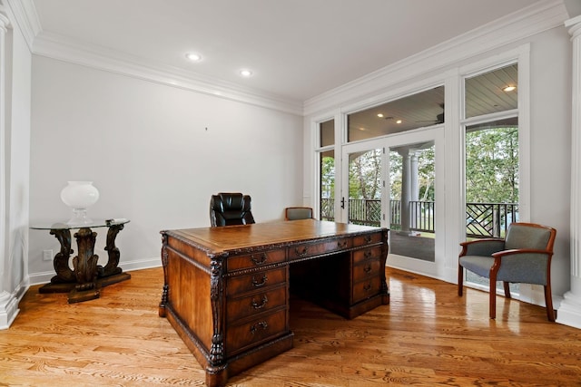 office space featuring crown molding and light hardwood / wood-style floors