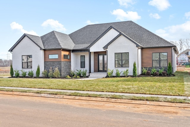 view of front of home featuring french doors and a front yard