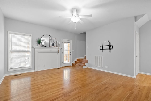 entryway with ceiling fan and light hardwood / wood-style floors