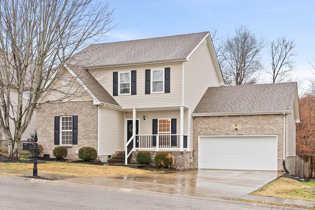 view of front of house featuring a garage and a porch