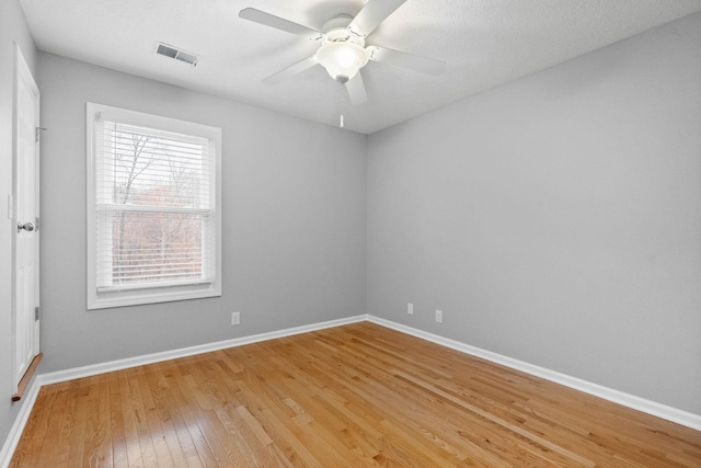 unfurnished room featuring hardwood / wood-style flooring and ceiling fan