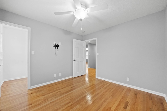 unfurnished room with light hardwood / wood-style flooring and ceiling fan