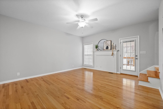 interior space with ceiling fan and light hardwood / wood-style flooring