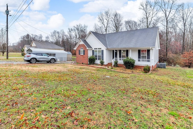 ranch-style house with central AC, a front lawn, and covered porch