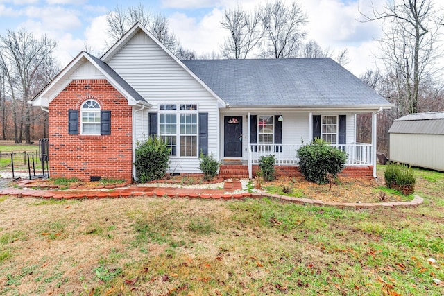 single story home featuring covered porch and a front lawn