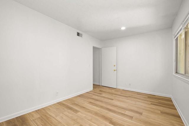 unfurnished room featuring light hardwood / wood-style flooring