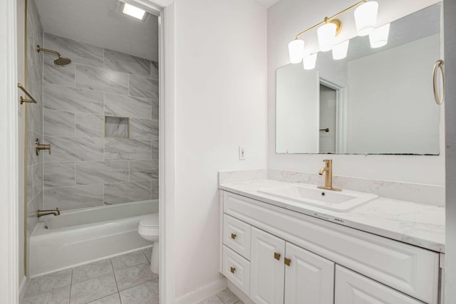 full bathroom with tiled shower / bath combo, vanity, tile patterned floors, and toilet