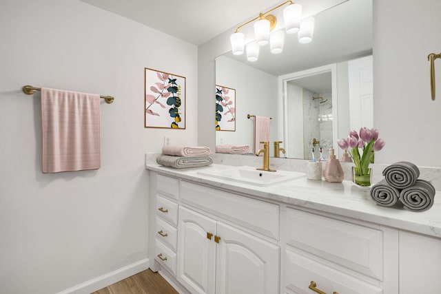 bathroom featuring vanity and wood-type flooring