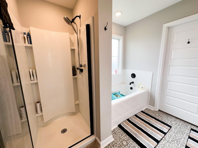 bathroom with shower with separate bathtub