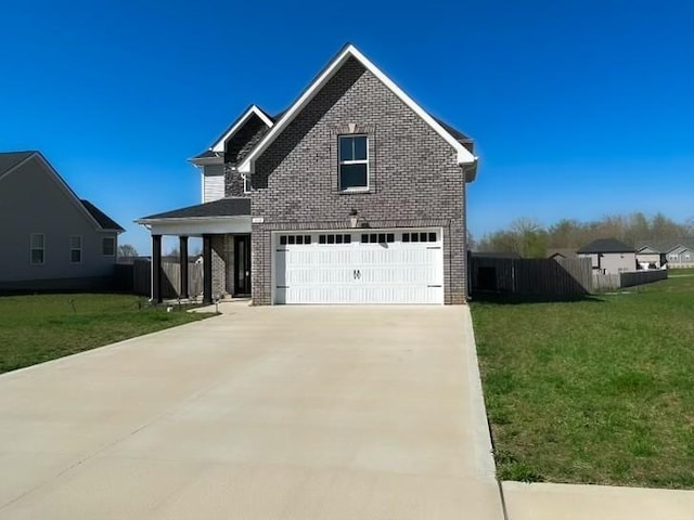 front facade featuring a garage and a front yard