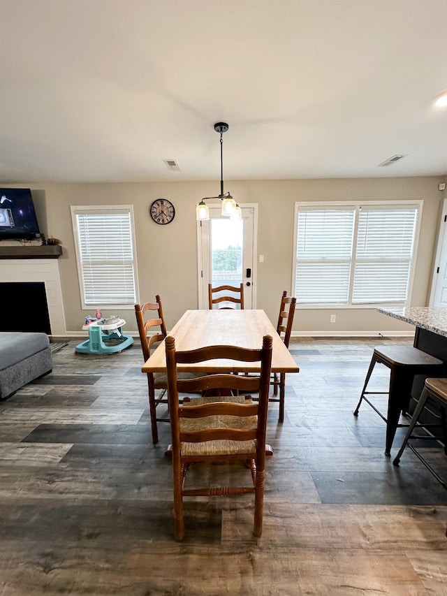 dining space with dark hardwood / wood-style floors