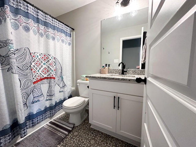 full bathroom with vanity, toilet, and shower / bath combo with shower curtain