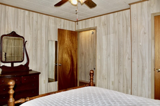 unfurnished bedroom with ceiling fan and ornamental molding