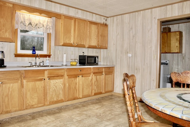 kitchen featuring sink and washer / clothes dryer