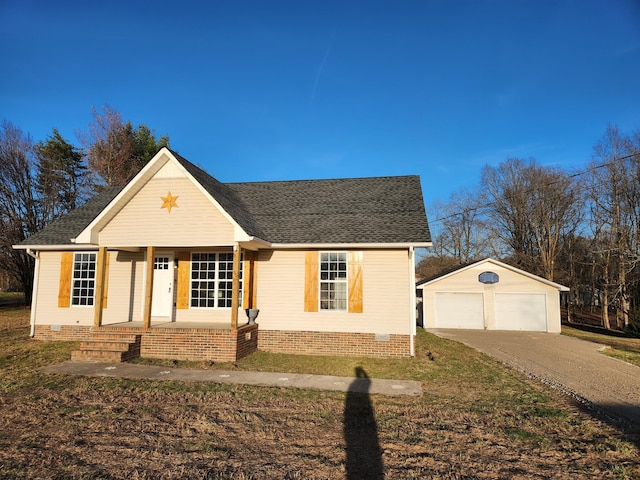 view of front facade with a garage, an outdoor structure, and covered porch