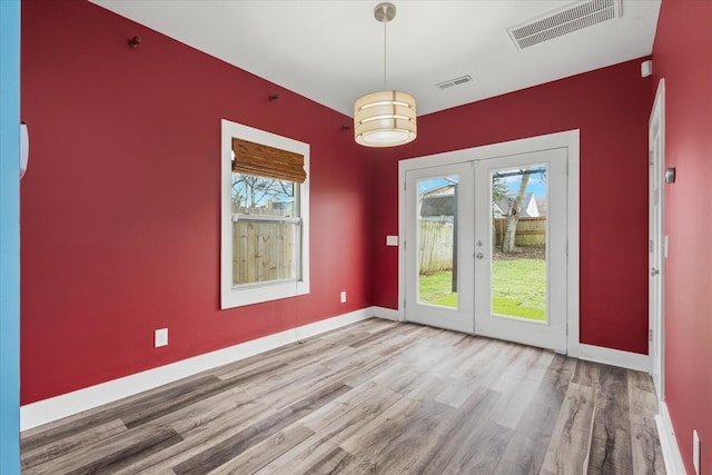 interior space featuring wood-type flooring and french doors