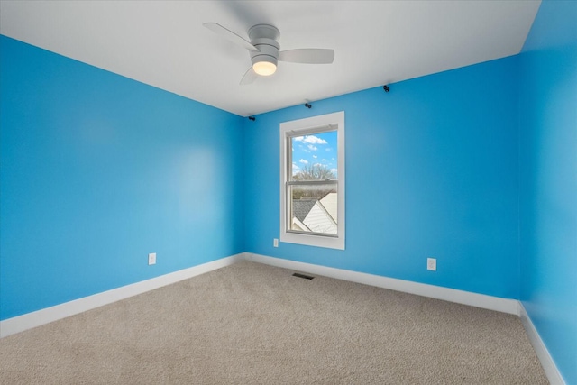 carpeted empty room with ceiling fan