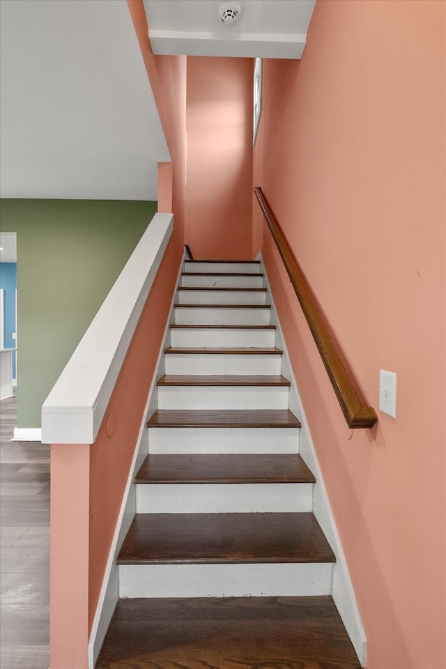 staircase featuring hardwood / wood-style floors