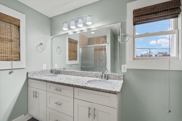 bathroom with vanity and an enclosed shower