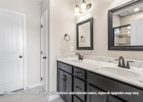 bathroom with vanity and an enclosed shower