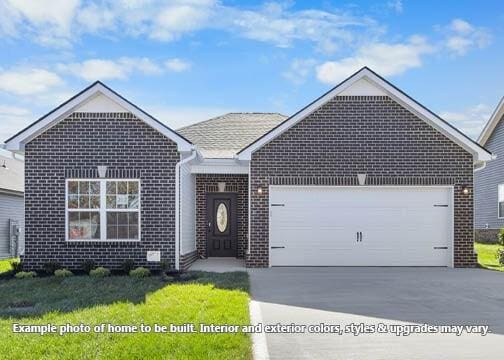 view of front of house featuring driveway, brick siding, and an attached garage