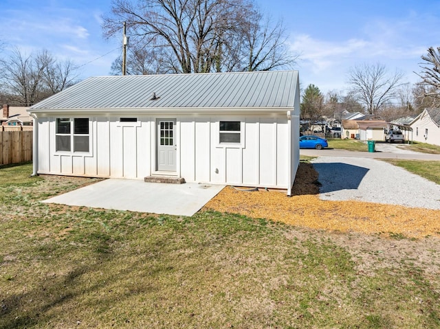 view of outbuilding with fence