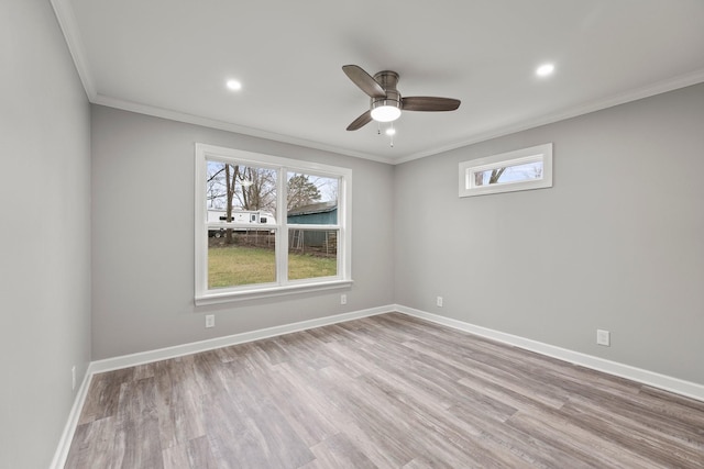 empty room with baseboards, a ceiling fan, crown molding, light wood-style floors, and recessed lighting