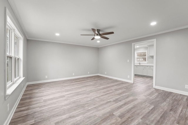 unfurnished room featuring ceiling fan, recessed lighting, baseboards, ornamental molding, and light wood finished floors